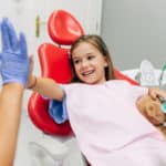 girl high five's the hygienist