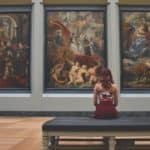 woman looking at art